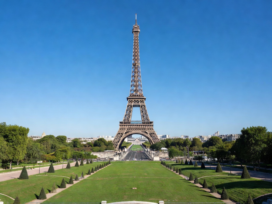 Eiffel Tower seen from Champ de Mars garden on a clear sunny day